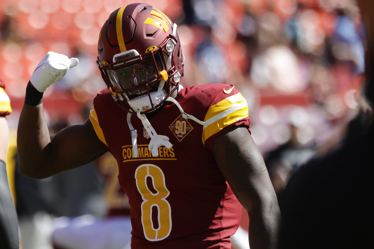 Washington Commanders running back Brian Robinson (8) stands on the field during warmups prior to the Commanders' game against the Tennessee Titans at FedExField.